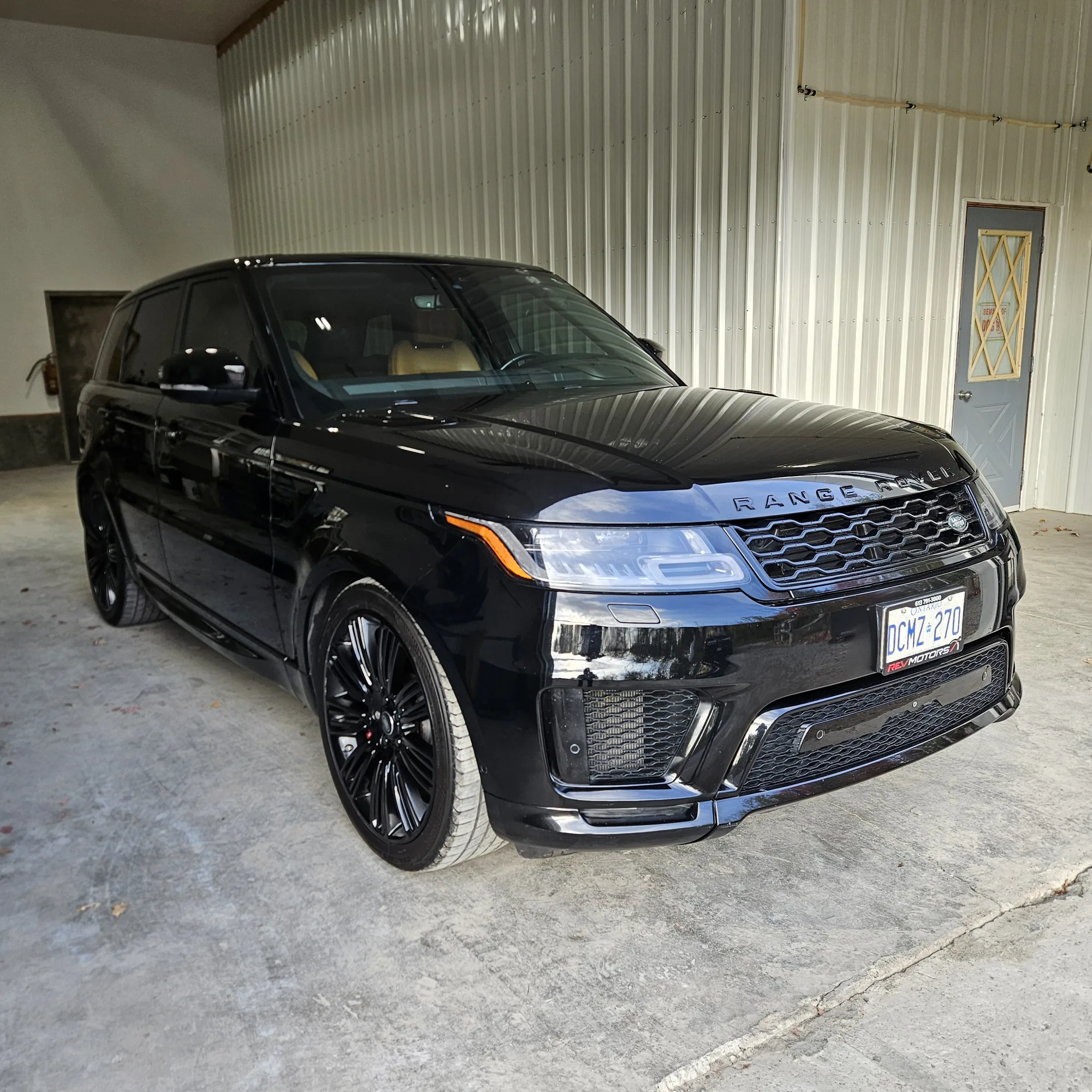 Black Range Rover after coating, in the shop